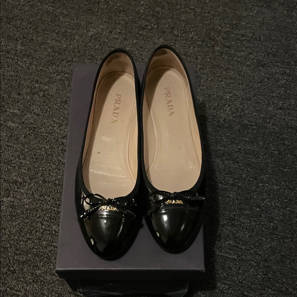 Prada Black Flats with Gold Accents
